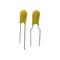 Two yellow, elongated capacitors with metal legs, spacing equal. Suitable for electronic circuits and assemblies.