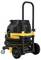 A yellow and black industrial vacuum cleaner with hoses and robust wheels. Ideal for construction sites and workshops.