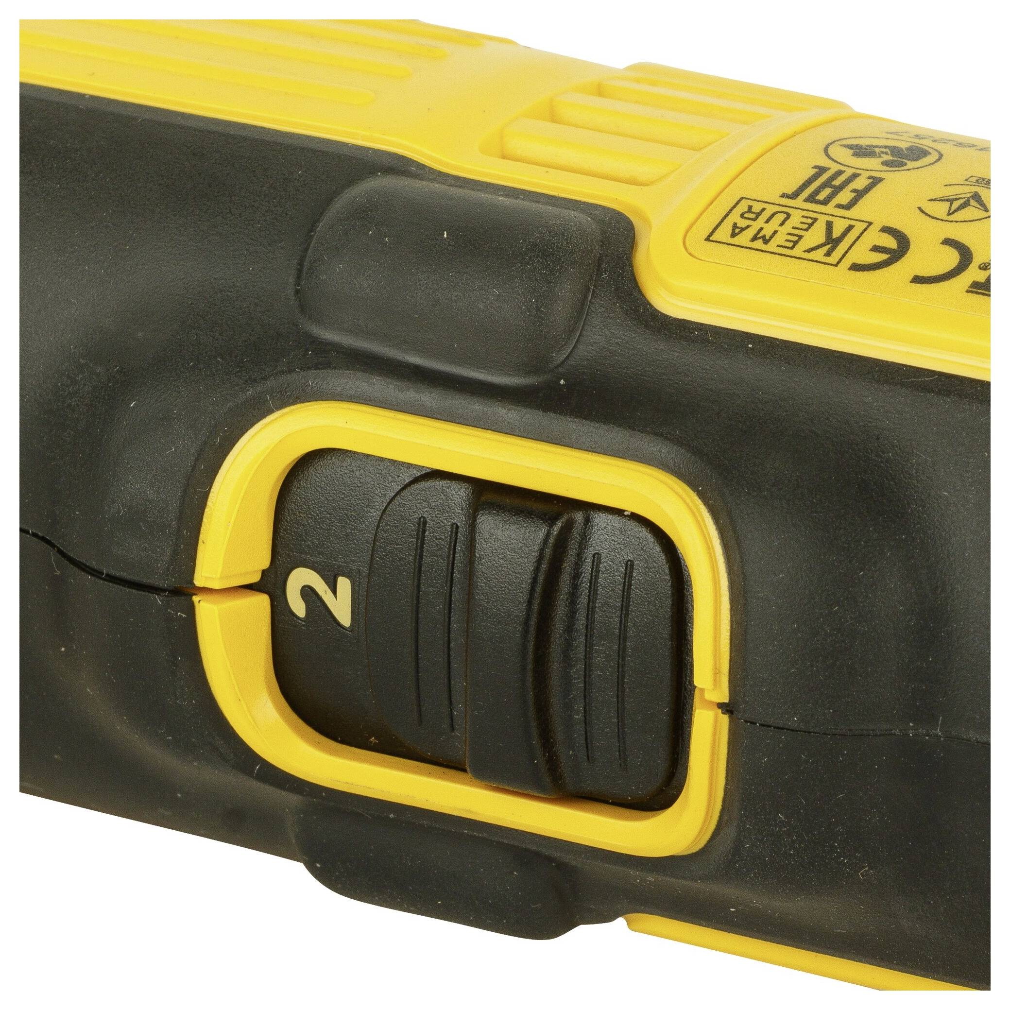 A yellow and black electric hand tool with a switch set to setting '2'.