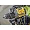 A person is holding a yellow cordless drill in their hand, ready for use. The focus is on the tool.