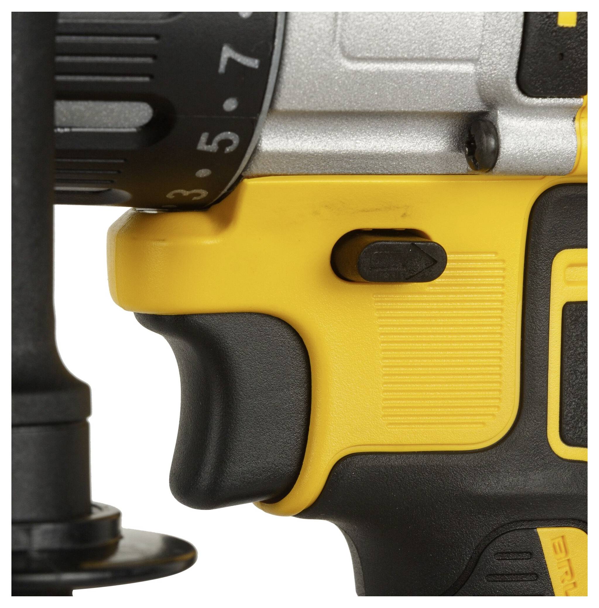 Close-up of a yellow and black cordless drill with visible handle and rotary switch.
