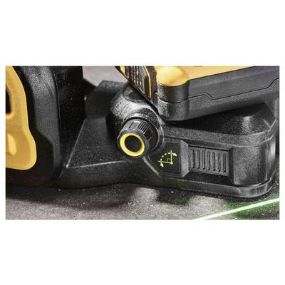 An electronic tool with an adjustment knob and a green laser beam on a surface, possibly for alignment purposes.