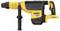 A yellow and black DeWalt hammer drill with a side handle and cable connection, suitable for heavy-duty construction work.