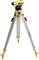 A yellow optical level mounted on a robust aluminium tripod, frequently used in construction for precise height measurement.