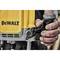 Close-up of a yellow tool with the 'DEWALT' logo being operated by a hand. Background blurred.