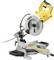 A yellow and silver mitre saw on a table, ready to cut wood or metal. It is electric and has an angle adjustment feature.
