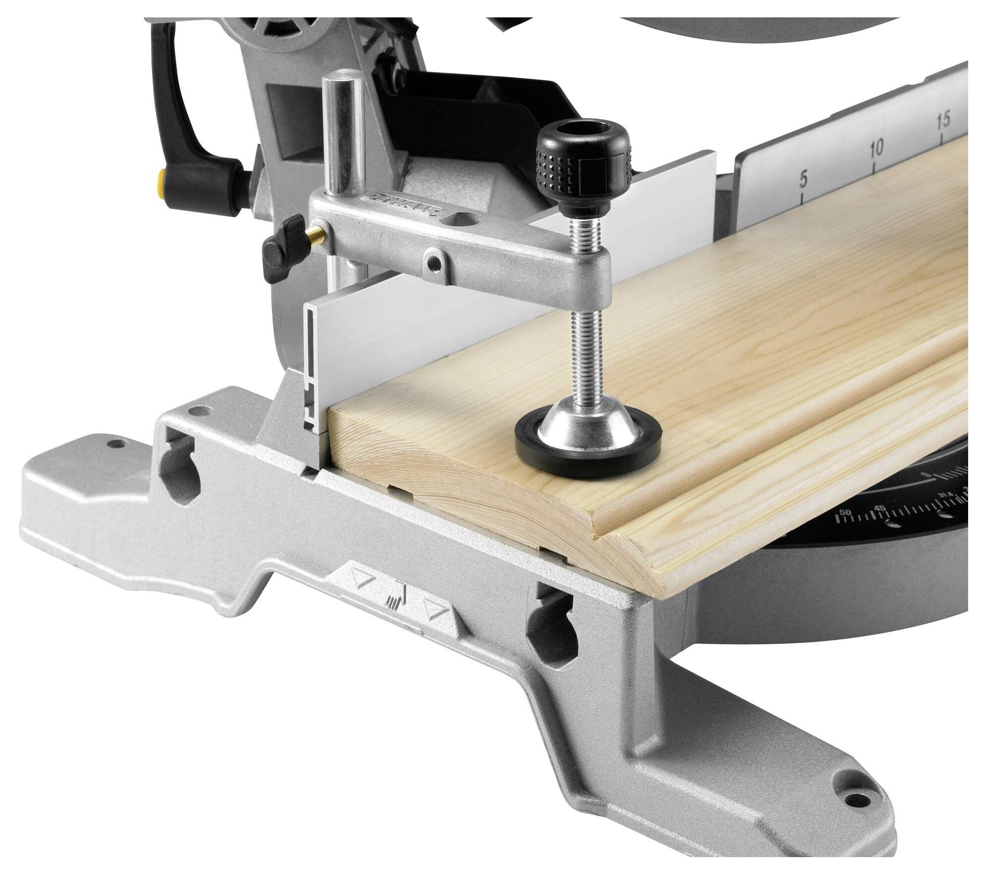 A circular saw cuts a wooden board. The board is secured with a clamp. The measurement scale indicates precise cutting guidance.