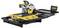 A yellow and black DeWalt table saw on a workbench, used for precise cutting of materials.
