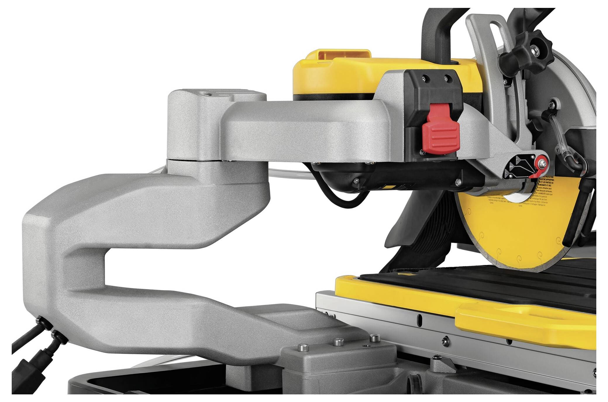 Electric mitre saw with yellow and grey casing placed on a table, ready to cut wood or other materials.