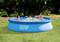 An inflatable swimming pool in the garden, with two adults and a child playing. The pool bears the label 'Intex Easy Set'. Trees are visible in the background.