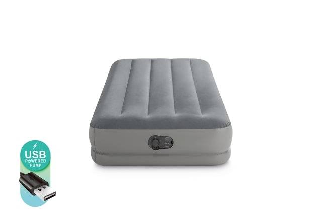 Grey air mattress with USB pump. Mattress features transverse air chambers for comfort. Pump shown to the left of the mattress.