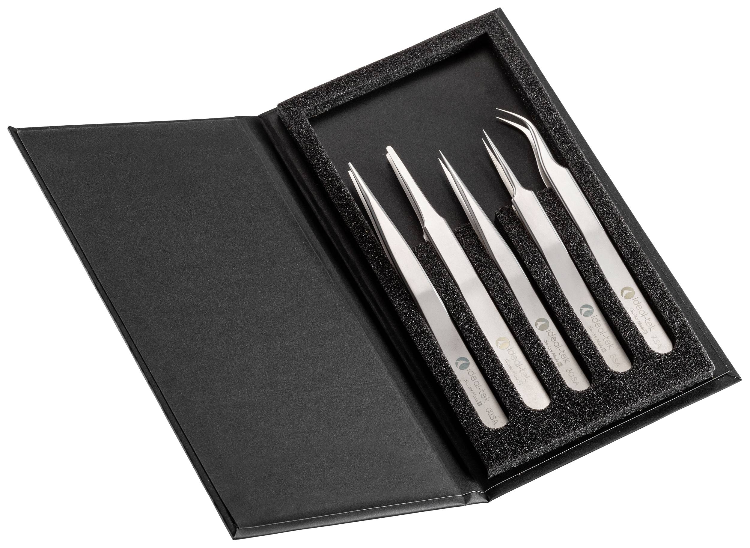An open case with five different tweezers nestled in a foam insert.