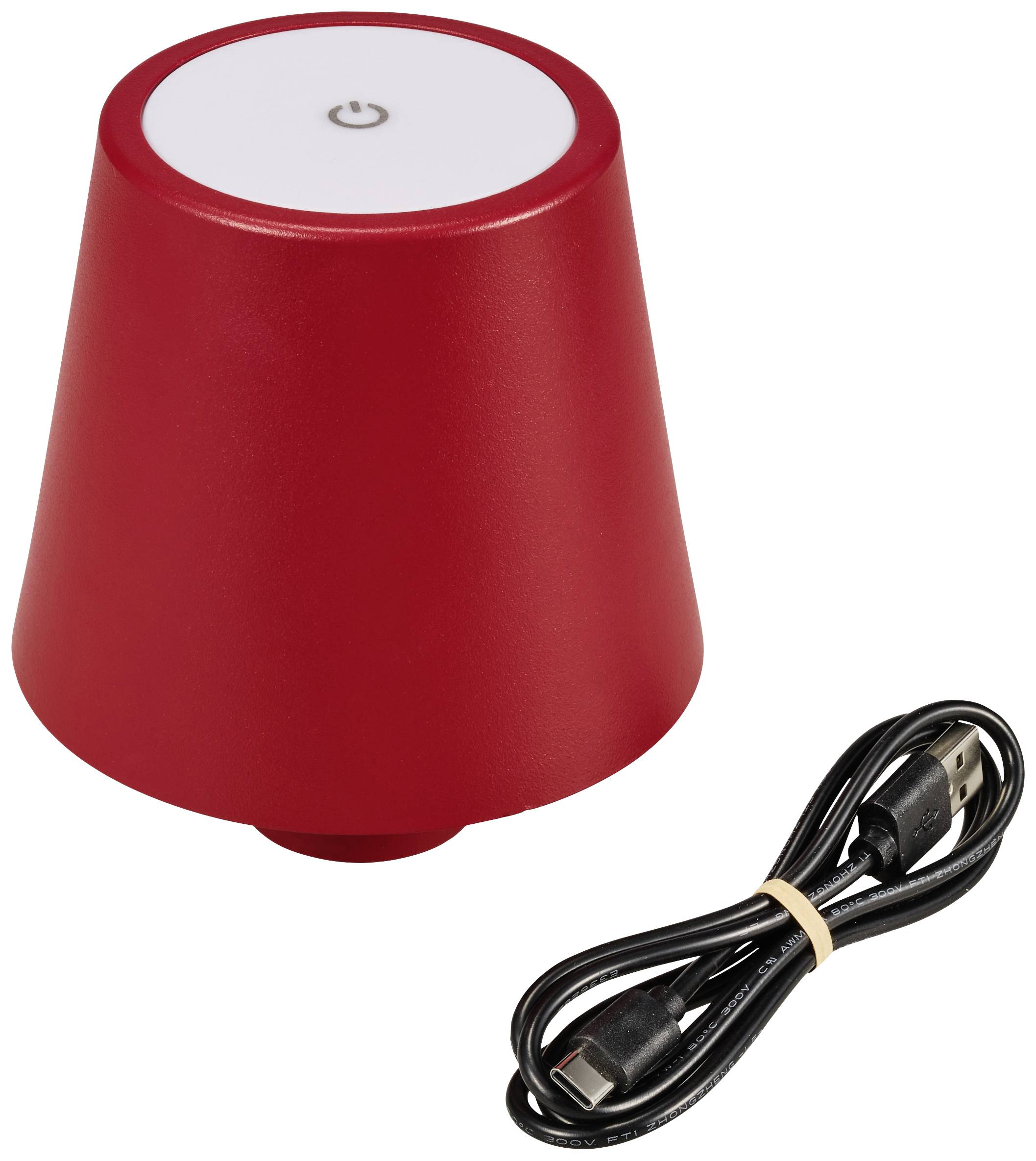 A red, cone-shaped lamp with a white on/off switch at the top. A USB cable for connection lies beside it.