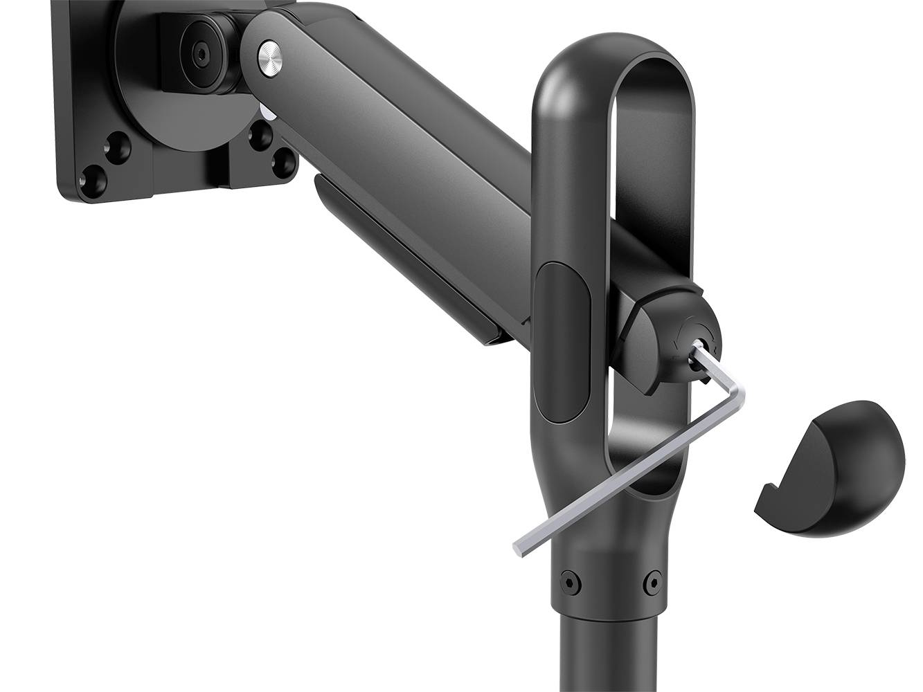 A black monitor arm with an adjustable joint, with an Allen key hanging from it. Mounting on a wall plate is visible.