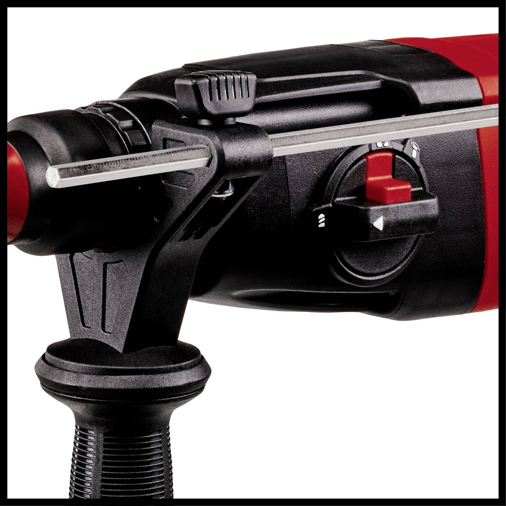 Close-up of a red and black electric tool with a rotary dial and a metal pin at the tip.