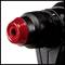 Close-up of a red and black cordless drill with focus on the chuck.
