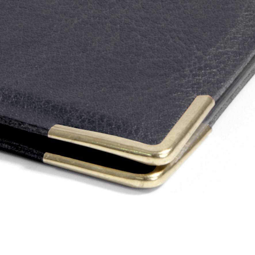 Close-up of a black leather folder with golden metal corners.