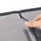 A hand closes the fastener of a transparent folder with black borders.