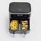 A dual-drawer hot air fryer, one drawer filled with chips, the other with chicken thighs. Digital display shows 200 degrees.