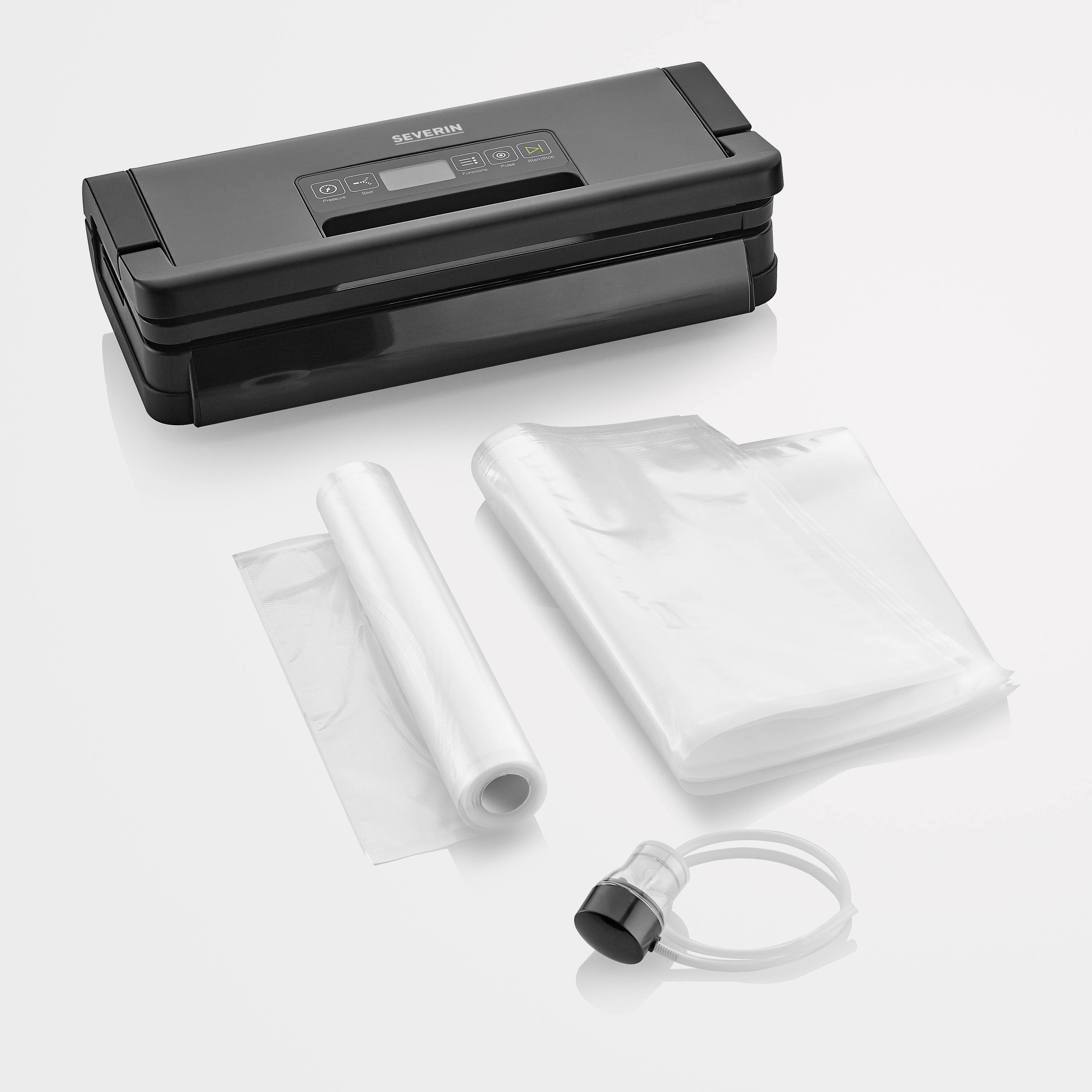 Black vacuum sealer with accessories, including vacuum bags, roll, and hose adapter, on a white background.