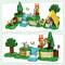 Two LEGO scenes with a rabbit figure in a green landscape. Top: tent, spade, tree. Bottom: waterfall, net, flowers. Colourful details.