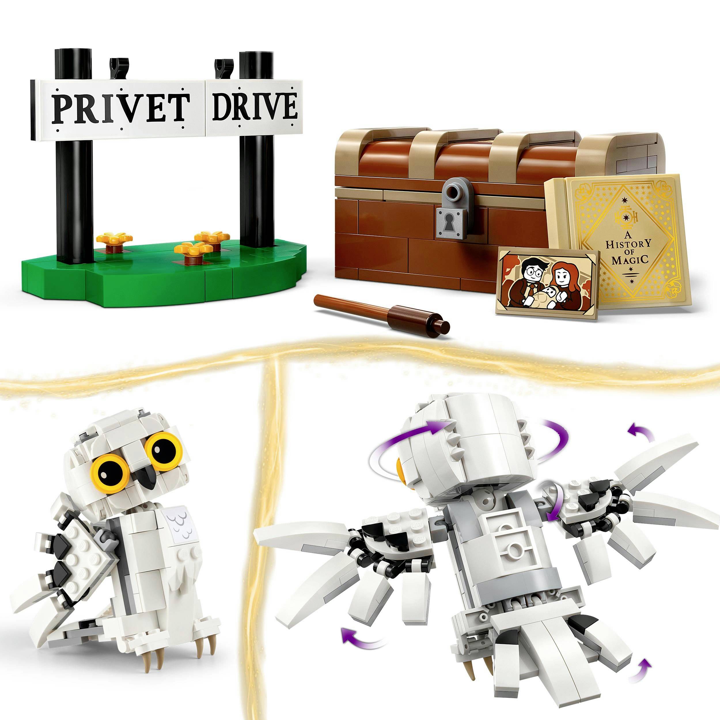 Toy set with 'Privet Drive' street sign, spell book, owl, and treasure chest. Inspired by a fictional magical world.