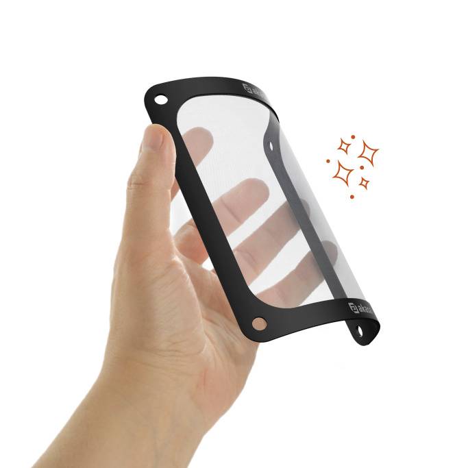 'A hand is holding a transparent, rectangular grid with rounded corners and two holes per side, suitable for computer fans.'