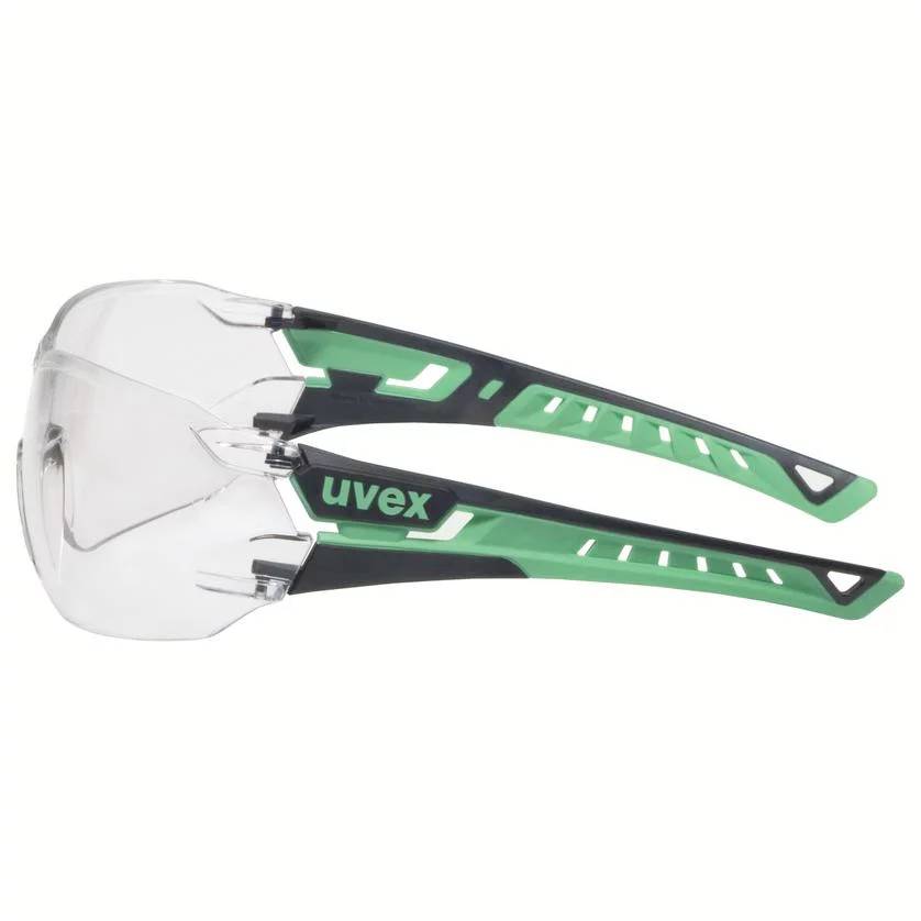 Safety glasses with clear lenses and black and green frame from Uvex, side view.