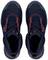 Black safety shoes with red accents, viewed from above. They have non-slip soles and laces.
