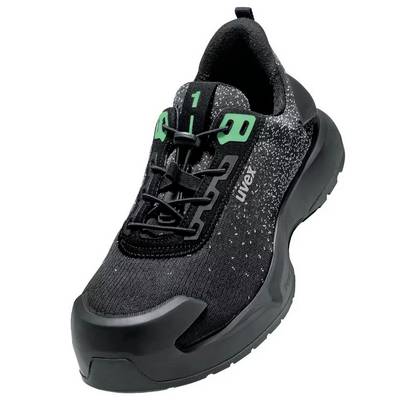 A black work shoe with green accents on the tongue, reinforced toe cap and rugged sole, suitable for workplace safety.