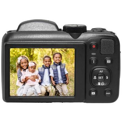 The image shows a camera screen displaying a photograph of four smiling children in an autumnal setting.