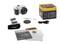 A digital camera with accessories: batteries, lens cap, shoulder strap, USB cable and instruction manual in front of packaging.