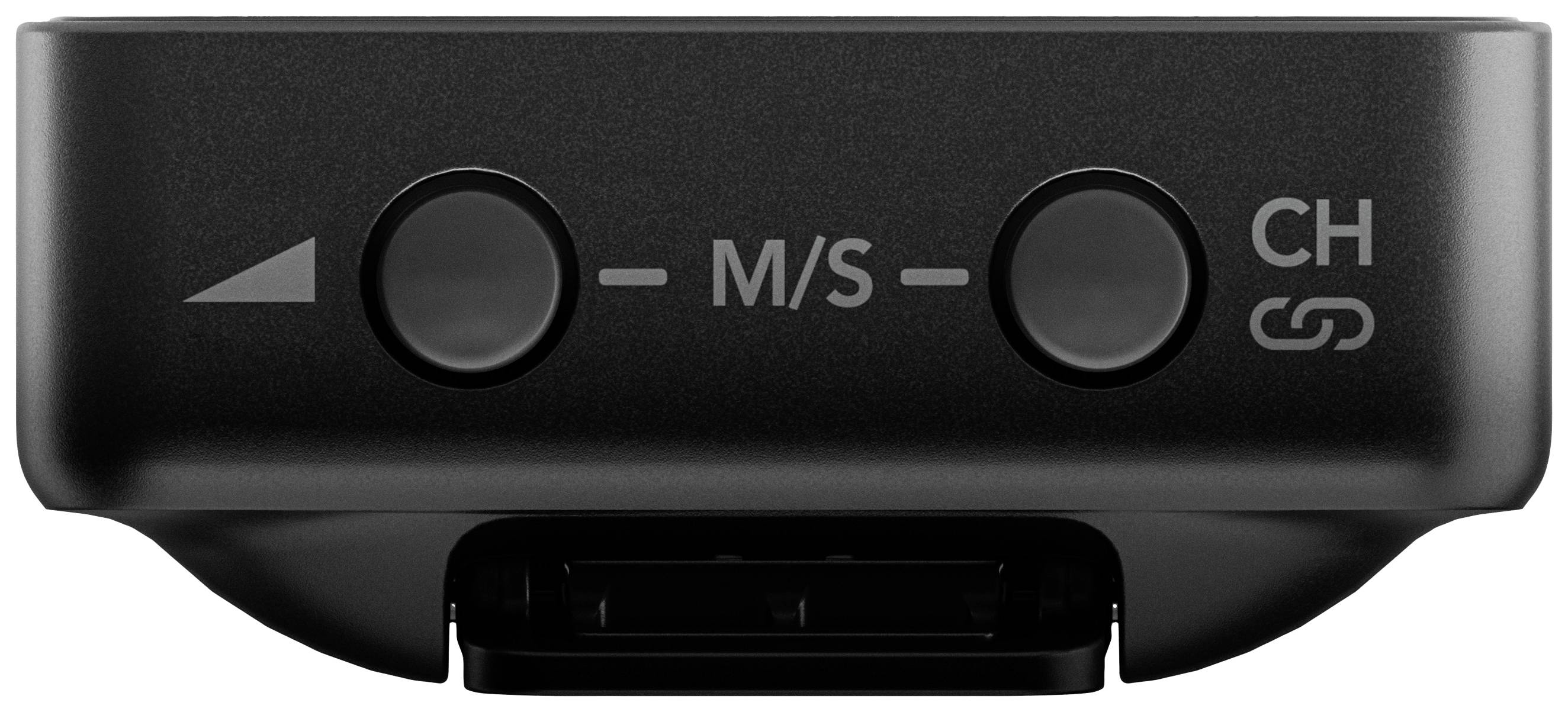 Black audio device with two buttons, labelled 'M/S' and 'CH'. Arrow on the left side. Underside with connection.