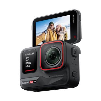 Digital camera with a movable display shows a smiling couple in a wintry landscape.