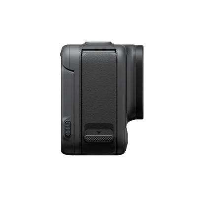 Digital camera from the side, showing the grip area and compact design.