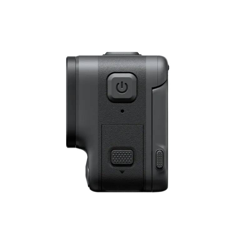 Side view of a black action camera with clearly visible details such as the power button and textured grip area.