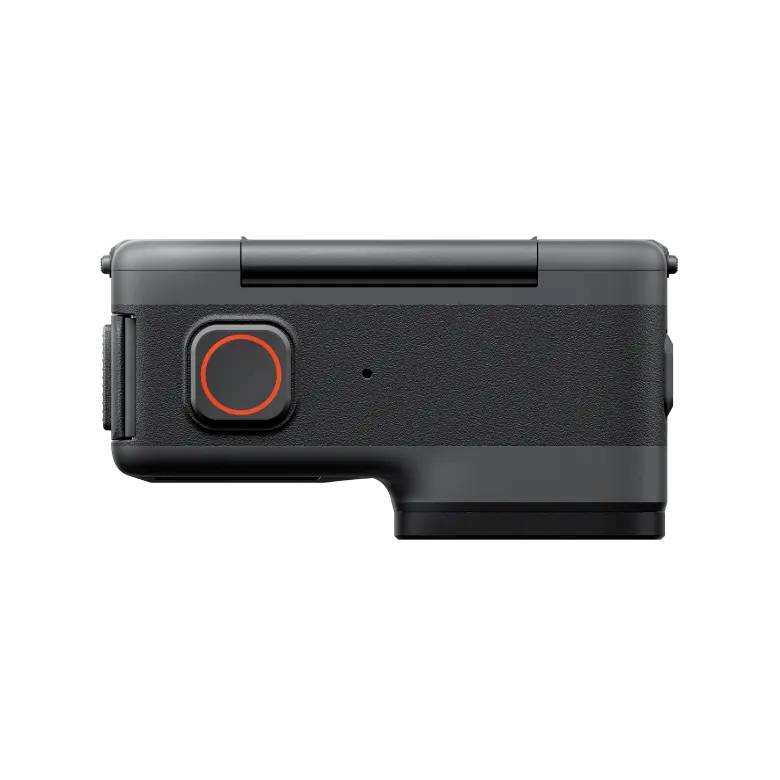 A black action camera with a red button on the side, compact and slim in design, suitable for outdoor recordings.