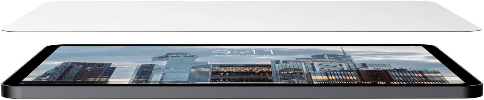 A tablet with an image of skyscrapers on the screen lies beneath a floating, thin panel.