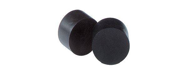Two black, cylindrical objects on a white background, one standing, the other lying down, both made of an unidentifiable material.
