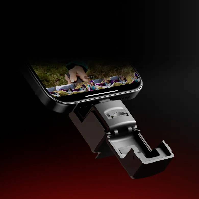 A smartphone mounted in a black stand. A colourful image is displayed on the screen.