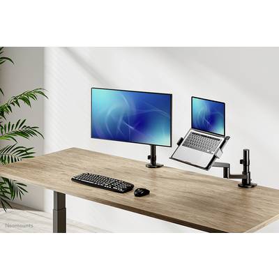 Height-adjustable desk with two monitors, wireless keyboard and mouse. Ideal for flexible working and ergonomics.