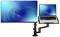 Laptop and monitor mounted on an adjustable desk arm with a blue screen, ideal for ergonomic working.