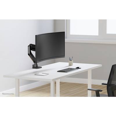 A modern, minimalist desk with a curved monitor on an adjustable arm, keyboard, pencil pot, and office chair.