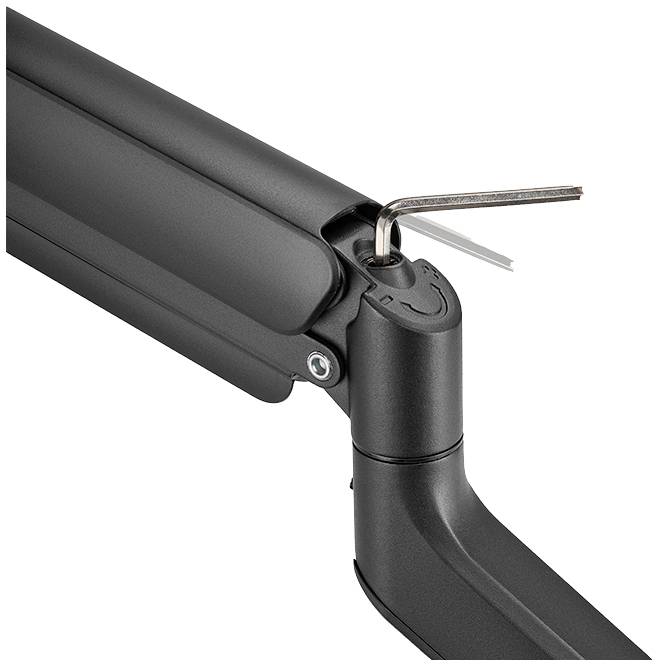 Black adjustable monitor arm with a spanner in the mounting bracket, used for adjusting tension or positioning.