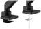 Two black monitor mounts compared: on the left with a clamp fixing, on the right with a screw fixing. Suitable for desk mounting.
