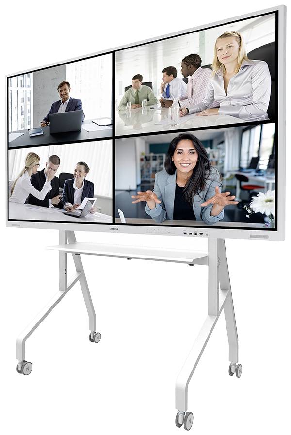 A large screen displays a virtual meeting with several people in four video windows, mounted on a mobile stand.