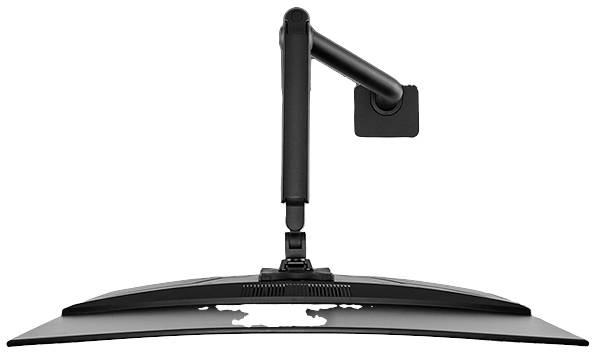 A curved monitor held by a flexible black arm mounted on a wall bracket.