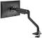 A black monitor arm, attached to a desk, holds a flat screen display. The arm is adjustable and pivotable.