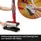 A person demonstrates how a cleaning roller is cleaned with a self-cleaning tool. Below it reads: 'Self-cleaning tool for cleaning the roller'.