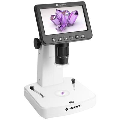 Digital microscope with screen shows an image of purple crystals. Device has control buttons and a white base.